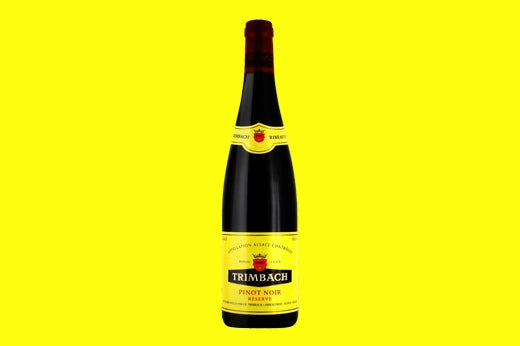 Bottle of 2013 Trimbach Pinot Noir Reserve on a bright yellow background