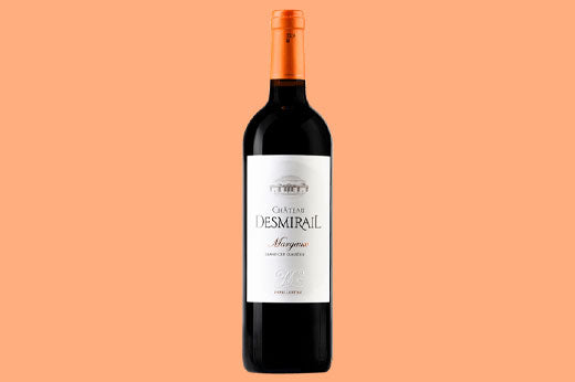 Bottle of 2015 Chateau Desmirail Margaux, white label with a crest, on an orange background