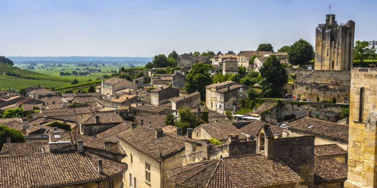Stone rooftops and church bell tower of a hilltop village in Bordeaux, France