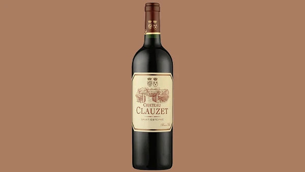 Bottle of Chateau Clauzet Saint-Estephe with a cream label and chateau engraving