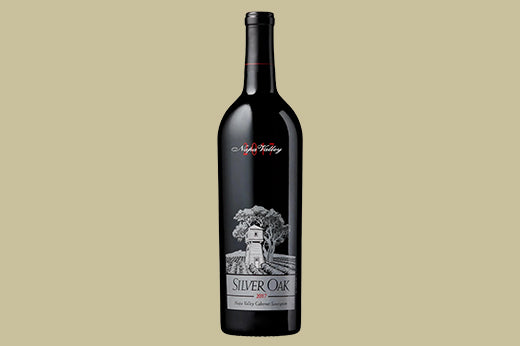 Bottle of 2017 Silver Oak Cabernet Sauvignon, Napa Valley, label with an illustrated barn and tree