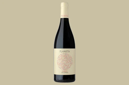 Bottle of 2020 Planeta Frappato, Sicily, cream label with a red spiral of small text