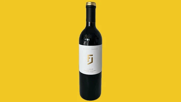 Bottle of Julien Fayard Cabernet Sauvignon, white label with a gold J monogram