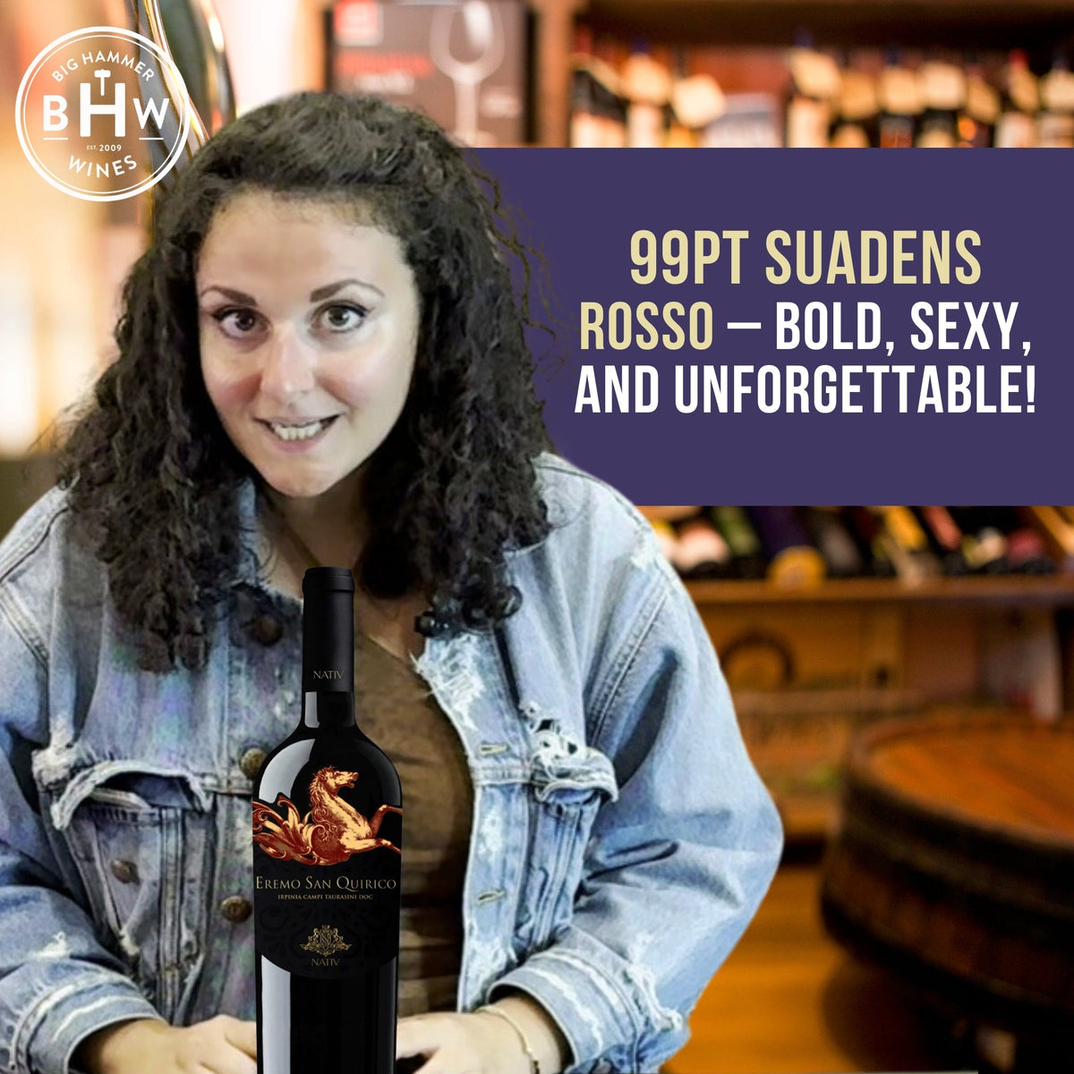 Woman in a denim jacket holding a bottle of Suadens Rosso, Big Hammer Wines logo in the corner
