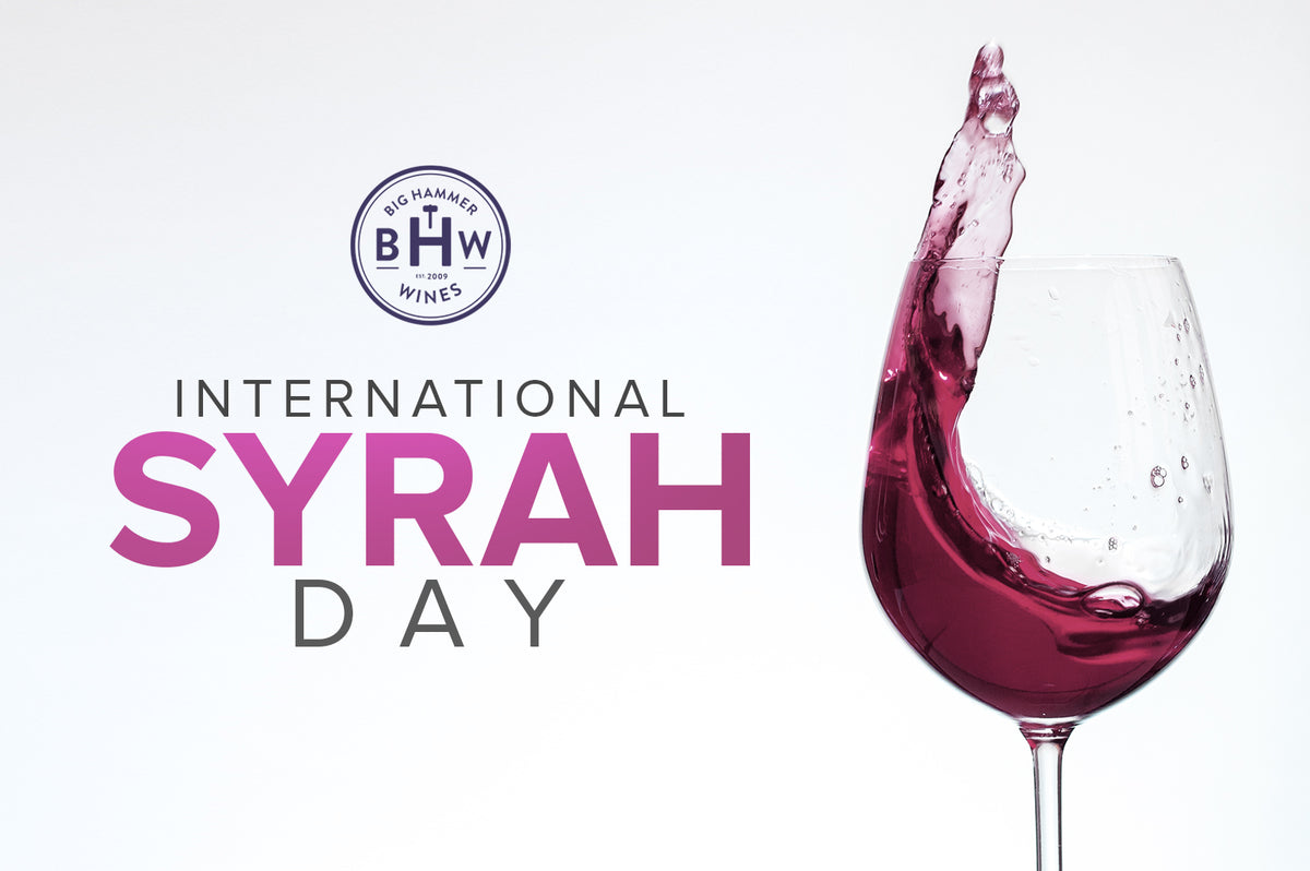 Graphic reading "International Syrah Day" with the BHW logo and red wine splashing in a glass