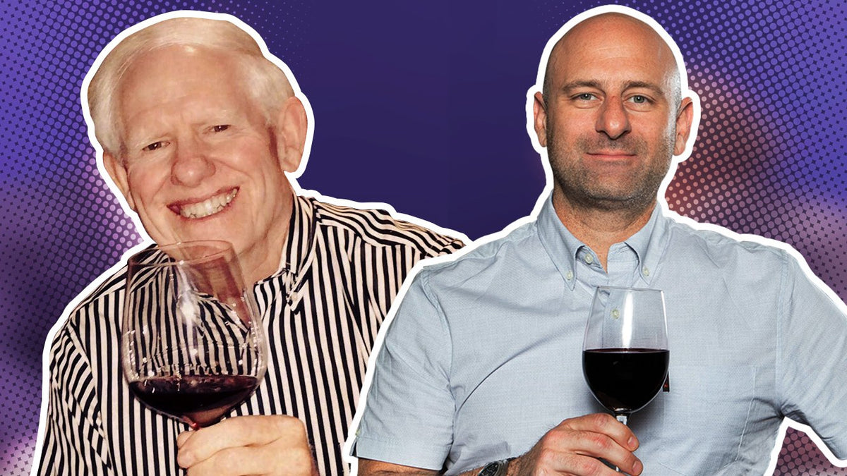 Rusty Gaffney holding a glass of red wine beside Greg Martellotto