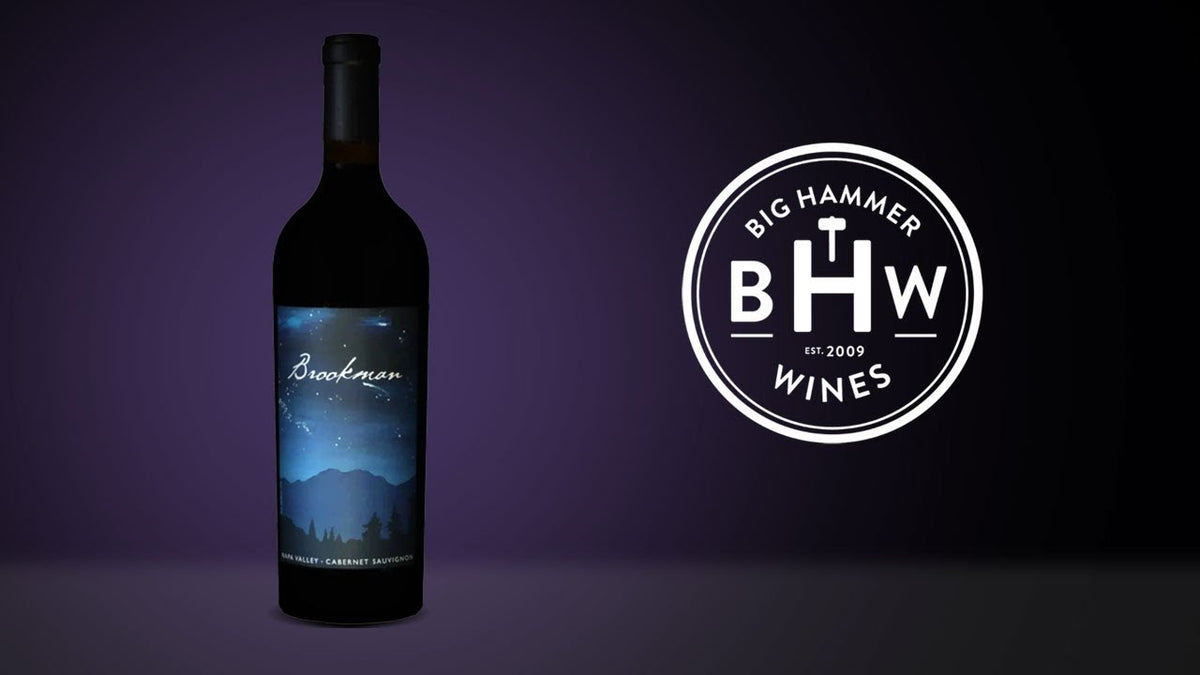 Bottle of Brookman Cabernet Sauvignon beside the Big Hammer Wines logo on a purple backdrop