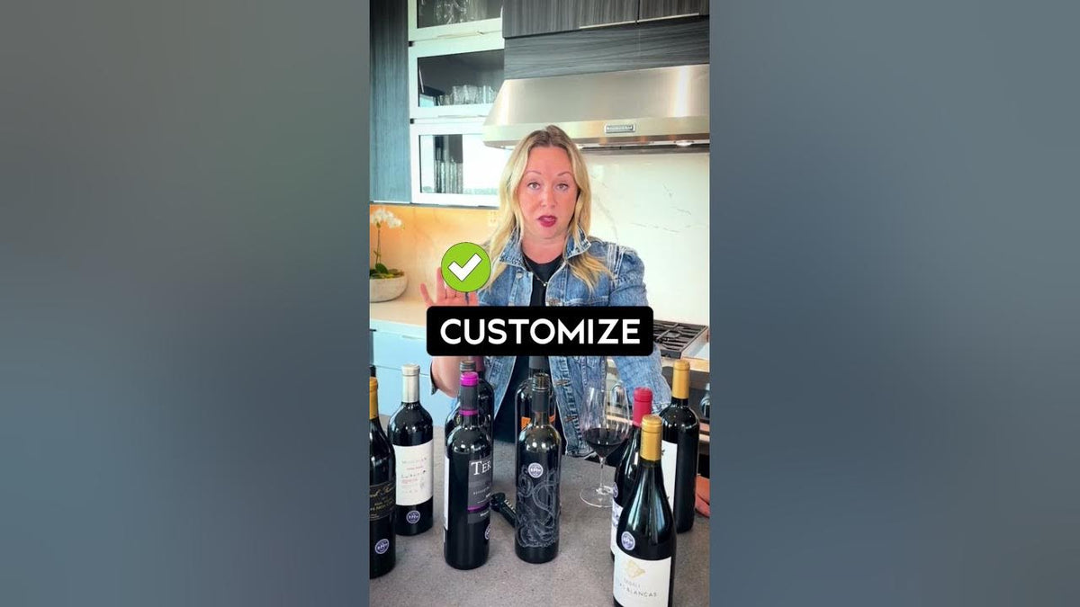 Woman in a kitchen behind several wine bottles with an on-screen caption reading "Customize"