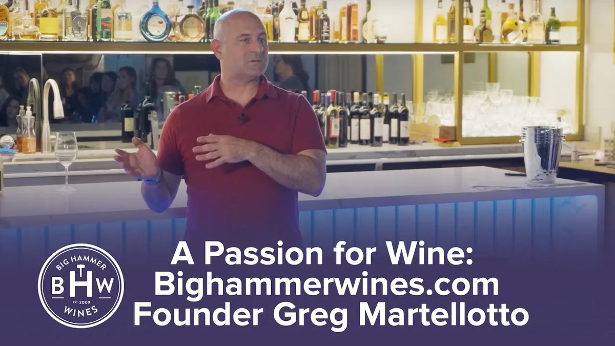 Title card: "A Passion for Wine: Bighammerwines.com Founder Greg Martellotto", man behind a bar