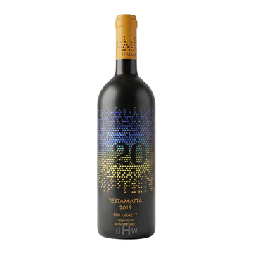 A bottle of 2019 Bibi Graetz '20th Anniversary' Testamatta Toscana IGT, featuring a sleek black design with a vibrant, multi-colored dot pattern forming the number "20."