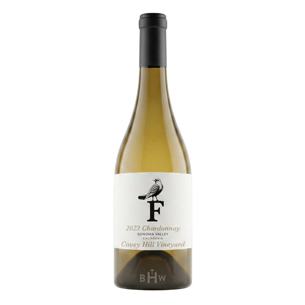 A bottle of 2022 Forthright Chardonnay from Covey Hill Vineyard, Sonoma Valley. The white label features a prominent black letter "F" with a bird perched on top. The wine is a pale straw color in a classic Burgundy-style bottle with a black capsule.