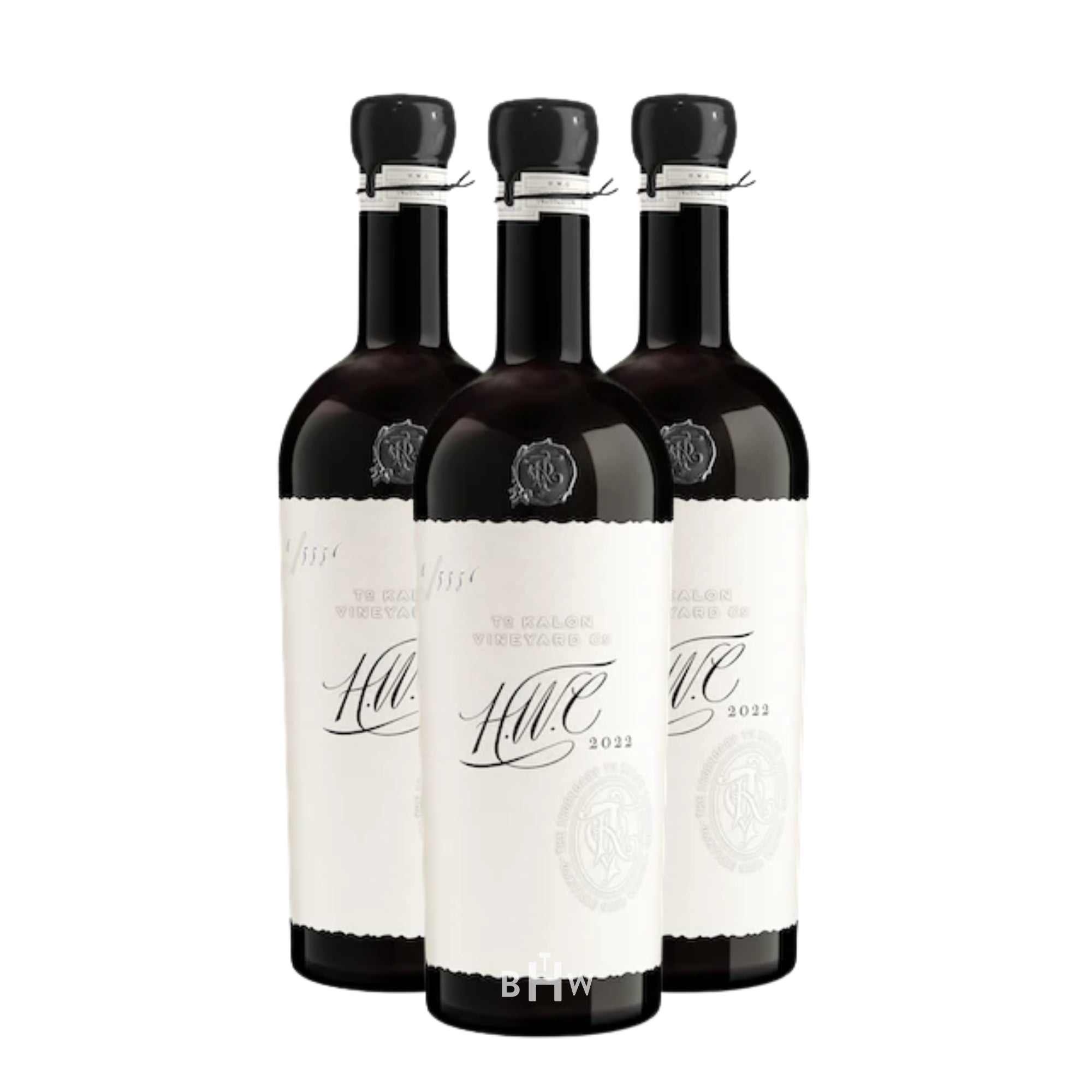 Three identical wine bottles of 2022 To Kalon Vineyard Co. 'HWC' Cabernet Sauvignon from Oakville, arranged in a tight cluster against a white background. Each bottle features a distinctive black wax-dipped seal, a cream-colored deckle-edged label with elegant "H.W.C" script, and a small embossed crest. Curated by Big Hammer Wines.