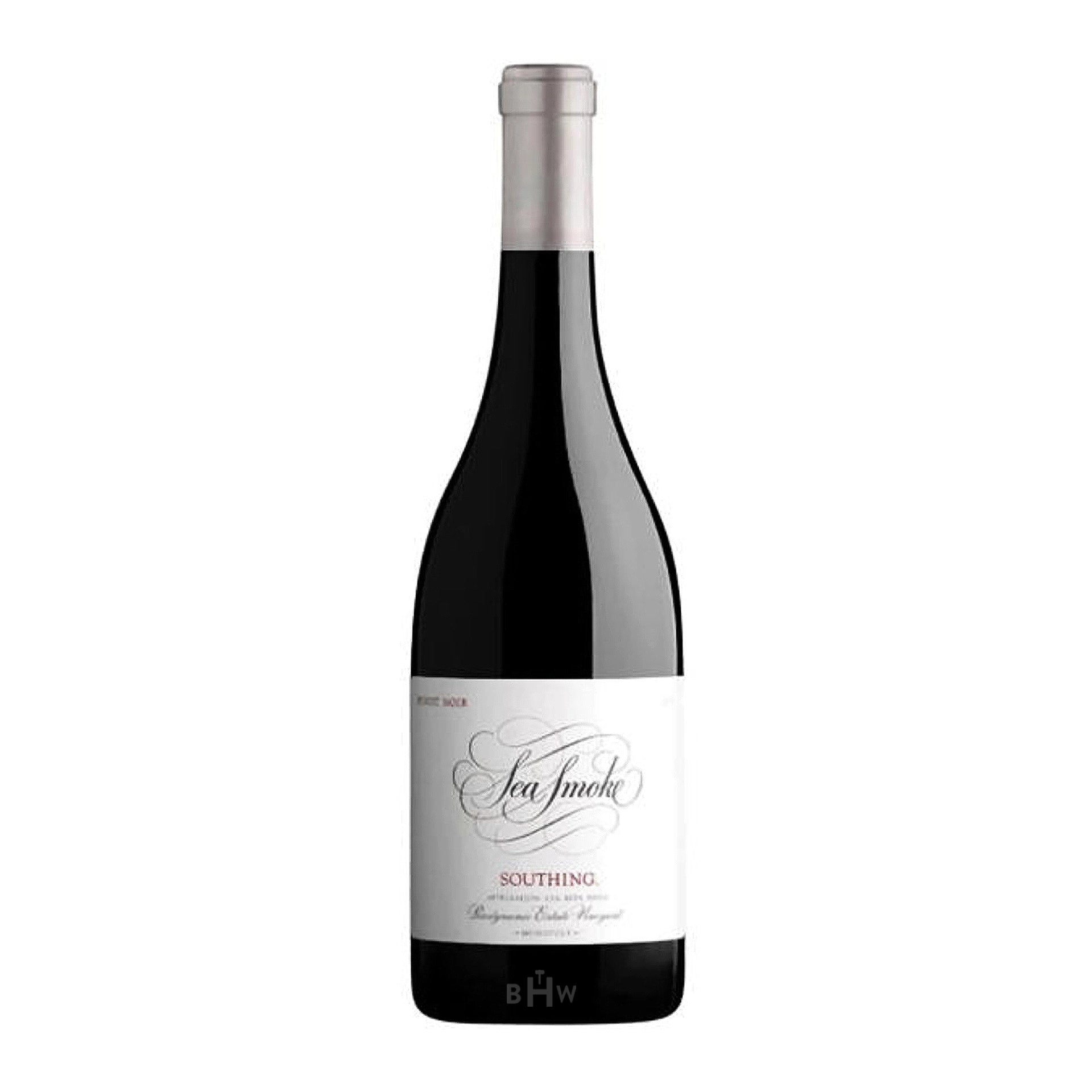 Red wine bottle with a white label on a white background
