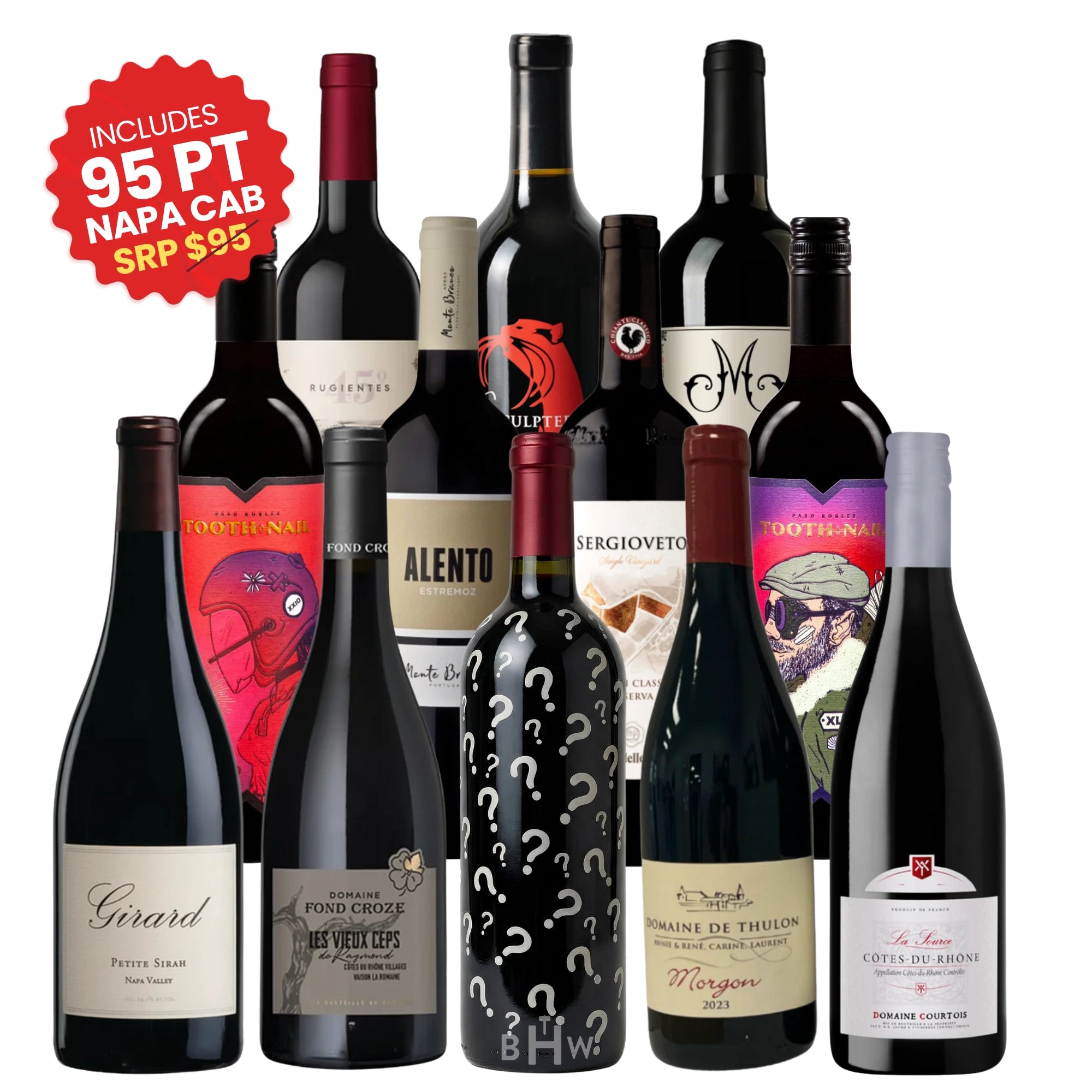 An assortment of 12 red wine bottles from the "Adventures in Wine" Wine Club, featuring various labels including a bottle covered in question marks and a red sticker highlighting an included 95-point Napa Cabernet, curated by big hammer wines.