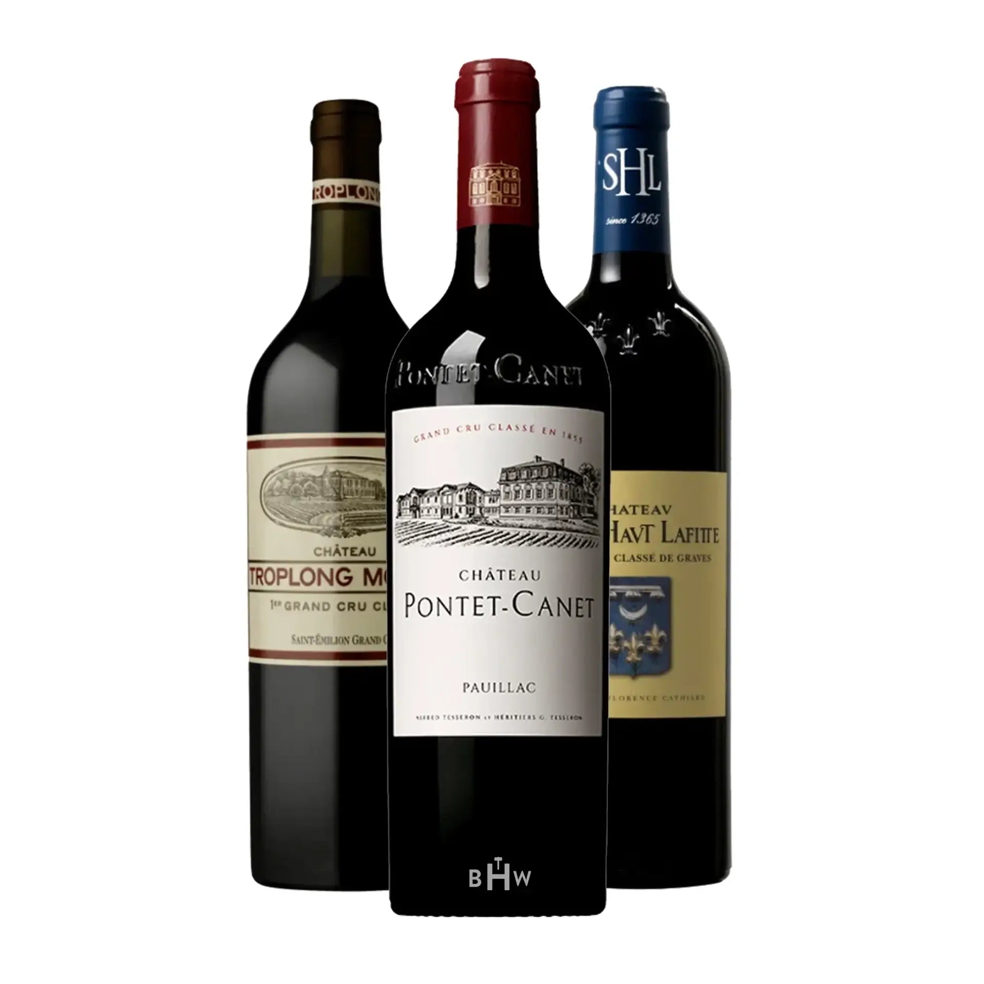 Three bottles of wine with labels from different estates on a white background