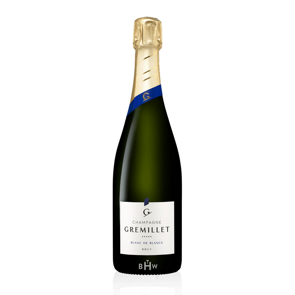 GremilletBlancdeBlancsChampagne bottle with a white background.