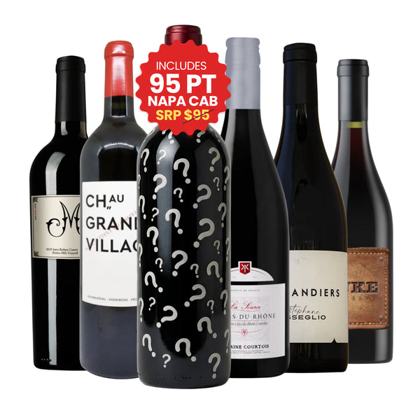 A selection of six bottles from the Red Wine Lovers Case, featuring a prominent mystery bottle with a red seal indicating it includes a 95-point Napa Cabernet Sauvignon (valued at $95), alongside labels from Grand Village and Côtes-du-Rhône, curated by Big Hammer Wines.
