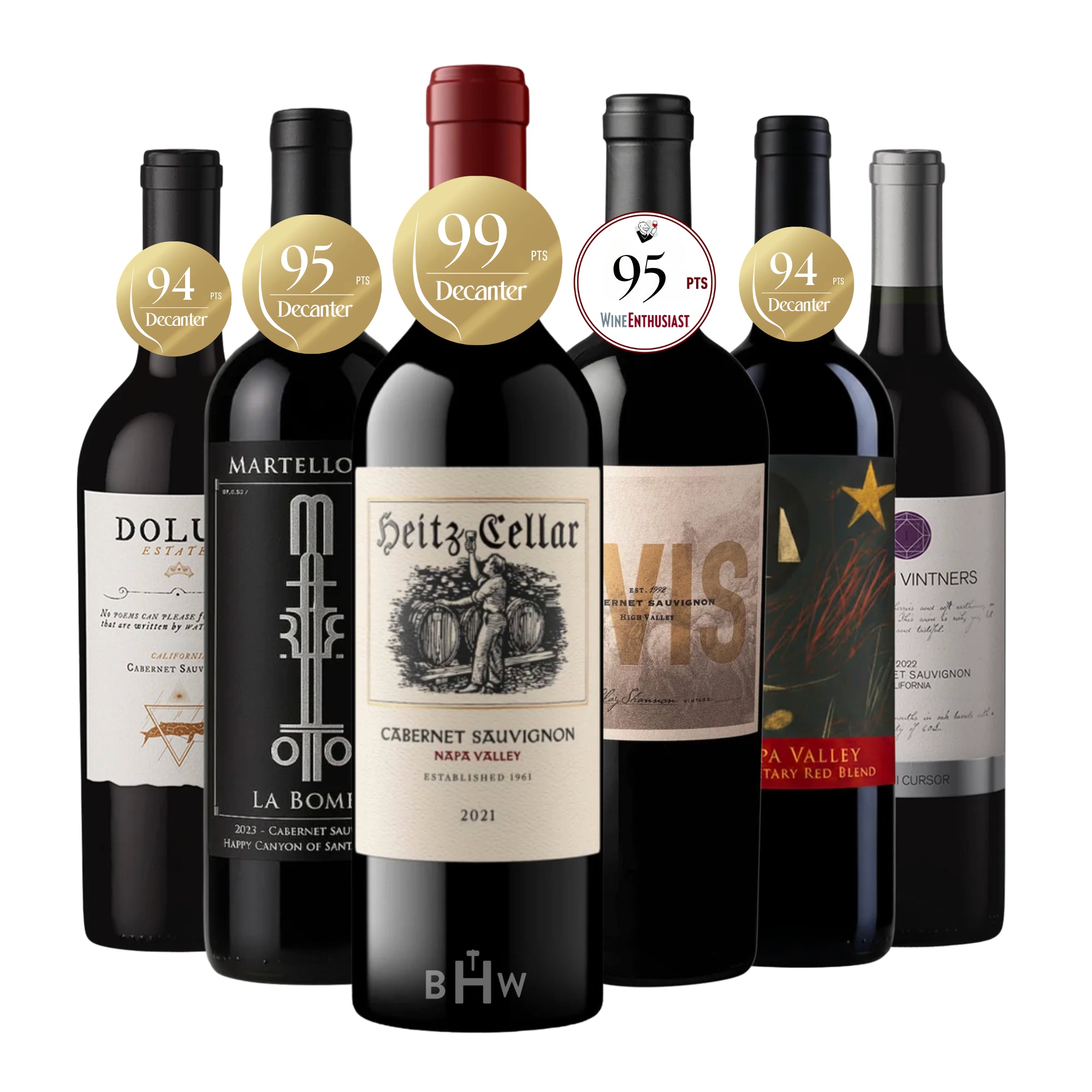 A lineup of six highly-rated American Cabernet Sauvignon bottles, prominently featuring critical acclaim medallions. The collection centers on a 2021 "Heitz Cellar" Napa Valley Cabernet Sauvignon (99 pts Decanter), flanked by "Martellotto La Bomba" (95 pts Decanter), "Dolu Estate," "Vis" High Valley (95 pts Wine Enthusiast), a Napa Valley Proprietary Red Blend (94 pts Decanter), and "Lan Vintners." This set highlights elite, top-scoring wines from California's premier growing regions. Curated by Big Hammer 