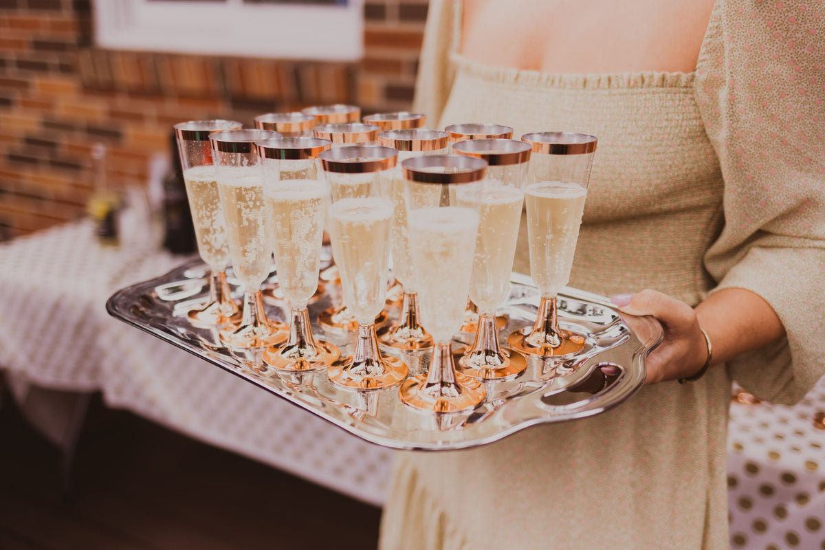 Champagne service on a silver tray at a private event